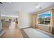 Inviting living room with hardwood floors and large windows, adjacent to the dining and kitchen area at 5178 Netherland St, Denver, CO 80249