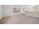 Spacious living room with neutral carpet, a half-wall staircase, and a bright, open feel at 5178 Netherland St, Denver, CO 80249