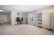 Open living room with large windows, neutral carpet, and modern lighting at 5178 Netherland St, Denver, CO 80249