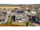 Aerial view of home and neighborhood featuring solar panels and large backyard at 6642 E 135Th Ave, Thornton, CO 80602