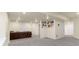 Large basement with carpeting, recessed lighting, and a comfortable sofa at 6642 E 135Th Ave, Thornton, CO 80602