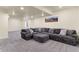 Spacious basement featuring a comfortable sectional sofa and carpeting at 6642 E 135Th Ave, Thornton, CO 80602