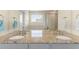 Beautiful bathroom featuring dual sinks, granite countertops, tub, and shower at 6642 E 135Th Ave, Thornton, CO 80602