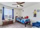 Cozy bedroom with window, carpet, and fan at 6642 E 135Th Ave, Thornton, CO 80602