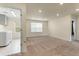 Neutral bonus room with carpet, recessed lighting, and adjacent laundry room at 6642 E 135Th Ave, Thornton, CO 80602