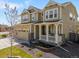 Charming two-story home with inviting front porch, meticulous landscaping, and a three-car garage at 6642 E 135Th Ave, Thornton, CO 80602