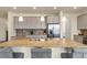 Spacious kitchen island with seating, granite countertops, and stainless steel appliances at 6642 E 135Th Ave, Thornton, CO 80602