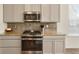 Modern kitchen featuring stainless steel appliances and granite countertops at 6642 E 135Th Ave, Thornton, CO 80602