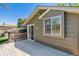 Deck featuring wooden railings and access to the backyard via a sliding glass door at 7521 S Race St, Centennial, CO 80122