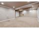 Basement featuring neutral walls and carpet, complemented by white trim and a closet at 7521 S Race St, Centennial, CO 80122