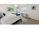 Serene bedroom featuring a soft rug, a ceiling fan and a big mirror at 7521 S Race St, Centennial, CO 80122