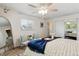 Comfortable bedroom featuring a ceiling fan, and a sliding closet door at 7521 S Race St, Centennial, CO 80122