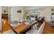 Elegant dining area open to the living room, featuring a stylish table setting and contemporary decor at 7521 S Race St, Centennial, CO 80122