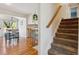 Bright entryway with hardwood floors, modern railings and stairs leading to the second floor at 7521 S Race St, Centennial, CO 80122