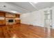 Spacious living room boasts hard wood floors, fireplace with built-ins, and bright light at 7521 S Race St, Centennial, CO 80122