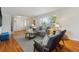 Cozy living room showcasing hardwood floors, modern seating, and plenty of natural light at 7521 S Race St, Centennial, CO 80122