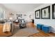 Stylish living room featuring hardwood floors, modern decor, and an open layout to the dining area at 7521 S Race St, Centennial, CO 80122