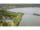 Wide aerial view of lakeside park featuring walking paths, playgrounds, and lush green spaces at 1568 Wolff St, Denver, CO 80204