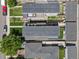 Bird's-eye view of two modern homes, featuring small backyards and an alley at 1568 Wolff St, Denver, CO 80204