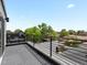 Enjoy city views from this spacious rooftop balcony, perfect for entertaining or relaxing outdoors at 1568 Wolff St, Denver, CO 80204