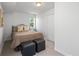 Cozy bedroom featuring a comfortable bed, large closet, and a window with natural light at 1568 Wolff St, Denver, CO 80204