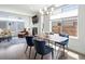 Bright dining area with modern lighting, comfortable seating, and a cozy fireplace in the background at 1568 Wolff St, Denver, CO 80204