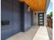 Contemporary home entrance featuring a stylish front door and modern siding at 1568 Wolff St, Denver, CO 80204