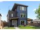 Modern home featuring a multi-level design and a rooftop deck at 1568 Wolff St, Denver, CO 80204