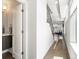 An inviting hallway with a powder room and access to the living area and staircase at 1568 Wolff St, Denver, CO 80204