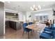 Open-concept living space with a modern kitchen, dining area, and comfortable seating area at 1568 Wolff St, Denver, CO 80204