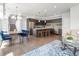 Open-concept living space showcasing a kitchen island and inviting dining area at 1568 Wolff St, Denver, CO 80204