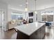 Bright open-concept living space with a modern kitchen and comfortable seating area at 1568 Wolff St, Denver, CO 80204