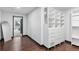 Organized walk-in closet with built-in shelves and drawers, with wood floor at 1900 E Girard Pl # 505, Englewood, CO 80113