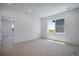 Neutral carpeted bedroom with bright light and a view at 3324 N Haleyville Ct, Aurora, CO 80019