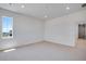 Bright carpeted bedroom with natural light from a window and recessed lighting at 3324 N Haleyville Ct, Aurora, CO 80019