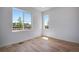 Bright bedroom with large windows offering plenty of natural light and views of the surrounding neighborhood at 3324 N Haleyville Ct, Aurora, CO 80019