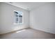 Empty bedroom with neutral carpet and bright natural light at 3324 N Haleyville Ct, Aurora, CO 80019