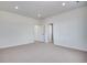 This spacious carpeted bedroom offers two doorways and recessed lighting at 3324 N Haleyville Ct, Aurora, CO 80019