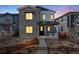 Charming two-story home with stone accents, a covered porch, and a well-maintained front yard at 3324 N Haleyville Ct, Aurora, CO 80019
