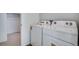 Laundry room featuring a white washer and dryer with a closet, offering convenience and functionality at 3324 N Haleyville Ct, Aurora, CO 80019