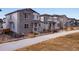 Street view featuring well-maintained two-story homes and front lawns at 3324 N Haleyville Ct, Aurora, CO 80019