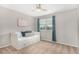 A bedroom with a daybed, under-bed storage, a ceiling fan, and window for lots of sunlight at 24525 E Wagon Trail Ave, Aurora, CO 80016