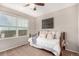 Bright bedroom with a daybed, large window, and a ceiling fan creates a welcoming atmosphere at 24525 E Wagon Trail Ave, Aurora, CO 80016