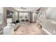 Stylishly furnished living room with large windows, modern decor, and a cozy atmosphere at 24525 E Wagon Trail Ave, Aurora, CO 80016