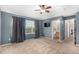 A spacious main bedroom featuring a ceiling fan and a doorway to the ensuite bathroom at 24525 E Wagon Trail Ave, Aurora, CO 80016