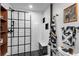 Stylish bathroom with subway tiles, a glass shower door, and a black hexagon tile floor at 2500 Walnut St # 106, Denver, CO 80205