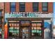 The Larimer Lounge building with a brick facade, signage, and entry featuring unique urban charm at 2500 Walnut St # 106, Denver, CO 80205