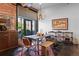 Stylish dining room featuring a unique light fixture, large window, wooden table, and decorative elements at 2500 Walnut St # 106, Denver, CO 80205