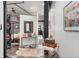 Stylish hallway with vintage luggage and decor, open to bedroom at 2500 Walnut St # 106, Denver, CO 80205