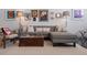 Comfortable living room featuring a sectional sofa, artwork, and a cozy, inviting atmosphere at 2500 Walnut St # 106, Denver, CO 80205